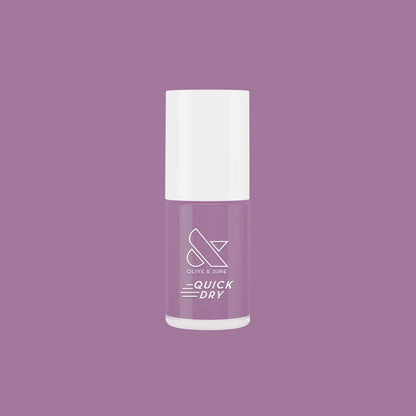 Bottle of Prairie quick dry nail polish in soft blooming purple by Olive and June for easy at-home manicures