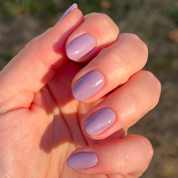 Hand displaying nails painted in glossy Prairie polish for an easy, long-lasting at-home manicure by Olive and June