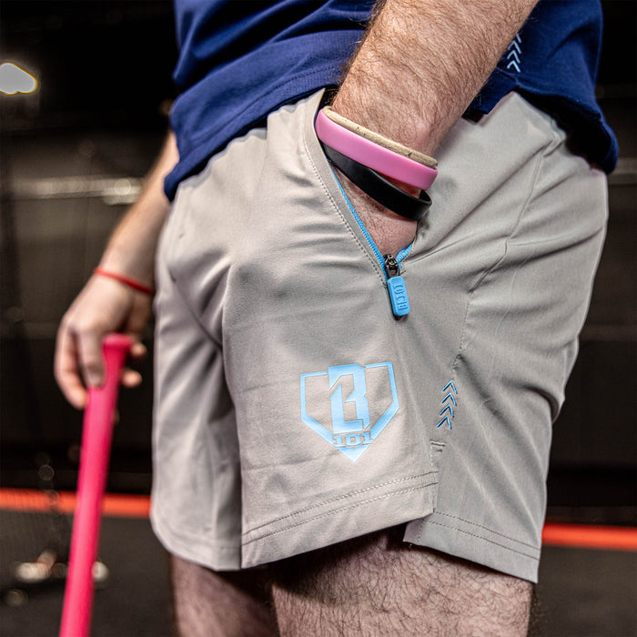 Youth model wearing gray and light blue Pro Series with Liner youth shorts