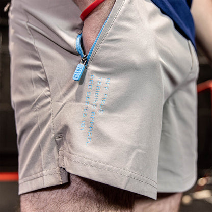 Youth model wearing gray and light blue Pro Series with Liner youth shorts