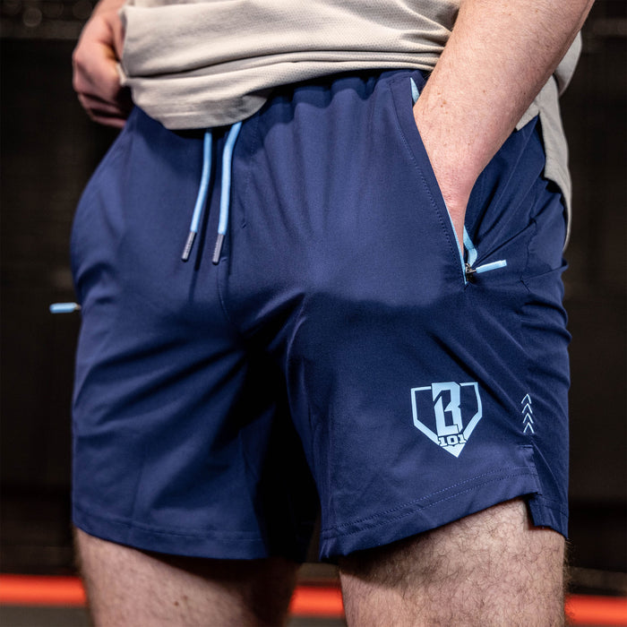 Youth model wearing navy and light blue Pro Series with Liner youth shorts