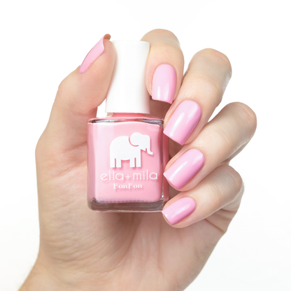 Pucker Up bubblegum pink nail polish manicure on a light skin tone with the bottle