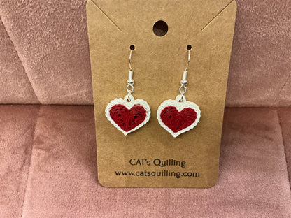 Colorful quilled heart earrings by Cat's Quilling featuring intricate paper coil designs and silver hooks for a charming look.