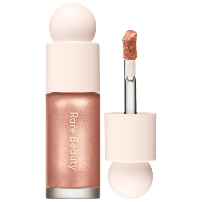 Rare Beauty Positive Light Liquid Luminizer Highlight in NWOB, showcasing the luminous liquid highlighter with sleek packaging.