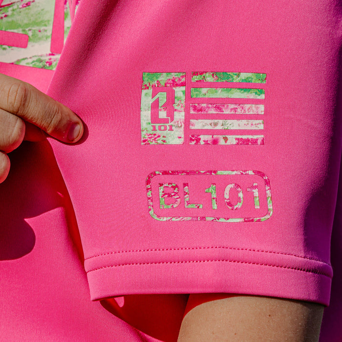 Close-up of a pink hoodie with green and pink 'BL101' logo.