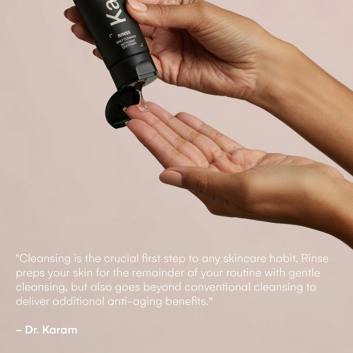 Hands holding a bottle of Rinse, squeezing some of the product out. "Cleansing is the crucial first step to any skincare habit. Rinse preps your skin for the remainder of your routine with gentle cleansing,, but also goes beyond conventional cleansing to deliver additional anti-aging benefits". - Dr. Karam