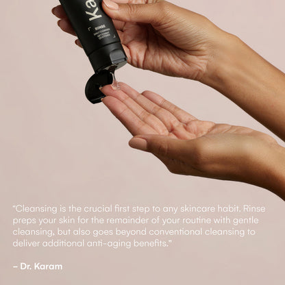 Hands holding a bottle of Rinse, squeezing some of the product out. "Cleansing is the crucial first step to any skincare habit. Rinse preps your skin for the remainder of your routine with gentle cleansing,, but also goes beyond conventional cleansing to deliver additional anti-aging benefits". - Dr. Karam