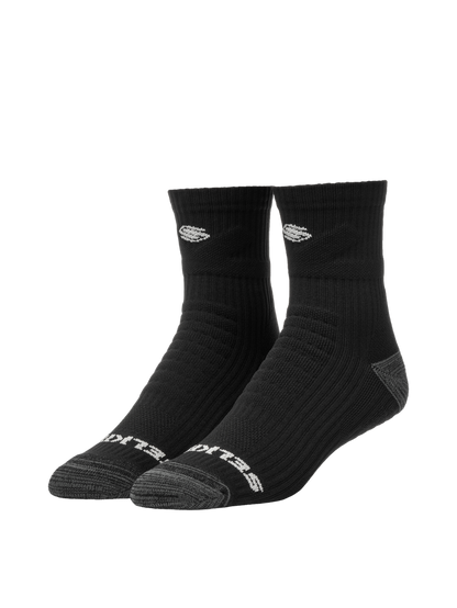 Three-quarter view of Selkirk Courtlock quarter socks showing ribbed ankle, cushioned gray toe, and white Selkirk logo on white background