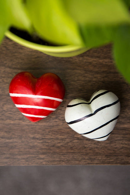 Colorful ceramic "Share the Love" paperweight from Ten Thousand Villages featuring a decorative, textured design.