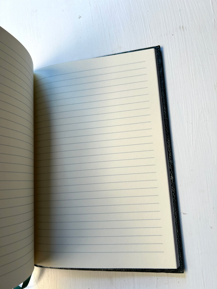 Black Sloane Stationery Make It Happen journal with lined pages, designed for home use and inspiring creativity.