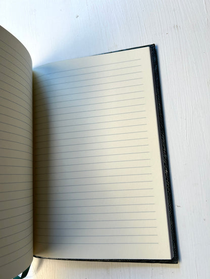 Black Sloane Stationery Make It Happen journal with lined pages, designed for home use and inspiring creativity.