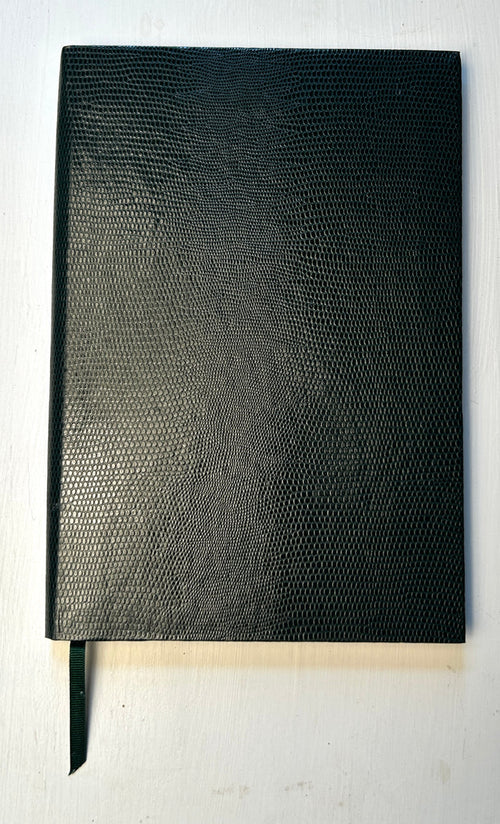 Dark green Sloane Stationery ruled journal with a hardcover and gold foil detailing, designed for home use.
