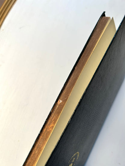 Dark green Sloane Stationery ruled journal with a hardcover, featuring a smooth textured cover and lined pages for note-taking.