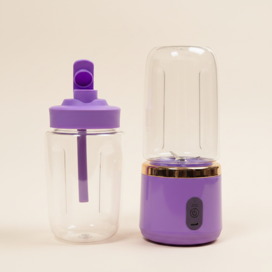Small portable dual mini blender juicer in purple with cream background