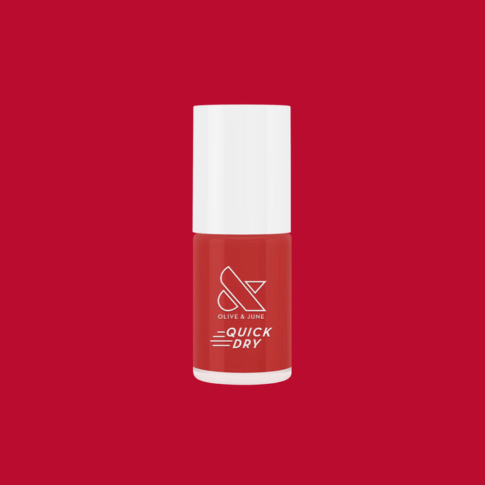 Smooch quick dry nail polish bottle in rich scarlet red on matching red background for at-home mani