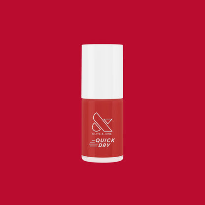 Smooch quick dry nail polish bottle in rich scarlet red on matching red background for at-home mani