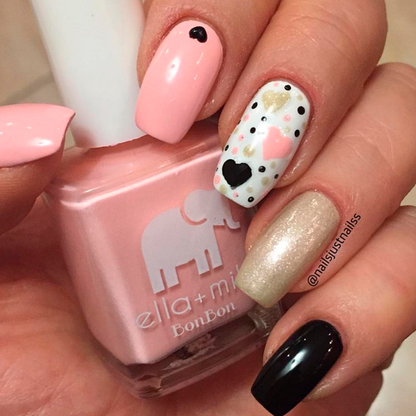 Sugar Puff baby pink nail polish with heart, gold and black accent nail art