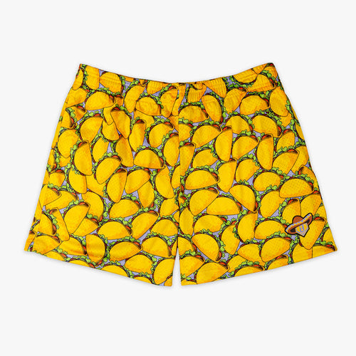 Yellow shorts with “Taco” design — front view