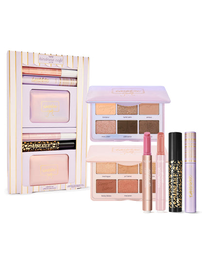 Makeup set with palettes, lipsticks, and other products on a white background