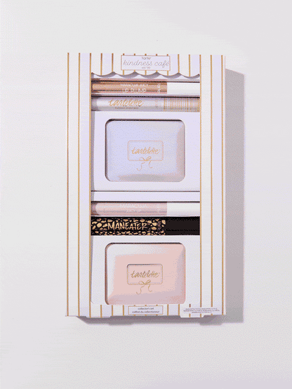 Cosmetic set, enclosed in a decorative white and gold-striped box, includes Tarte products: Maracuja Juicy Lip, Tartelette mascara, and Tartelette palettes. Text: Tarte kindness café, collector's set, MARA-CUJA JUICY LIP, MANEATER.