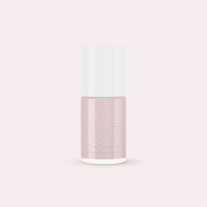 Bottle of The Usual nail polish by Olive and June in a neutral lavender grey shade for manicure essentials