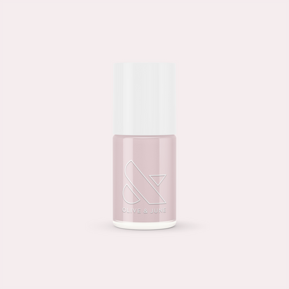 Bottle of The Usual nail polish by Olive and June in a neutral lavender grey shade for manicure essentials
