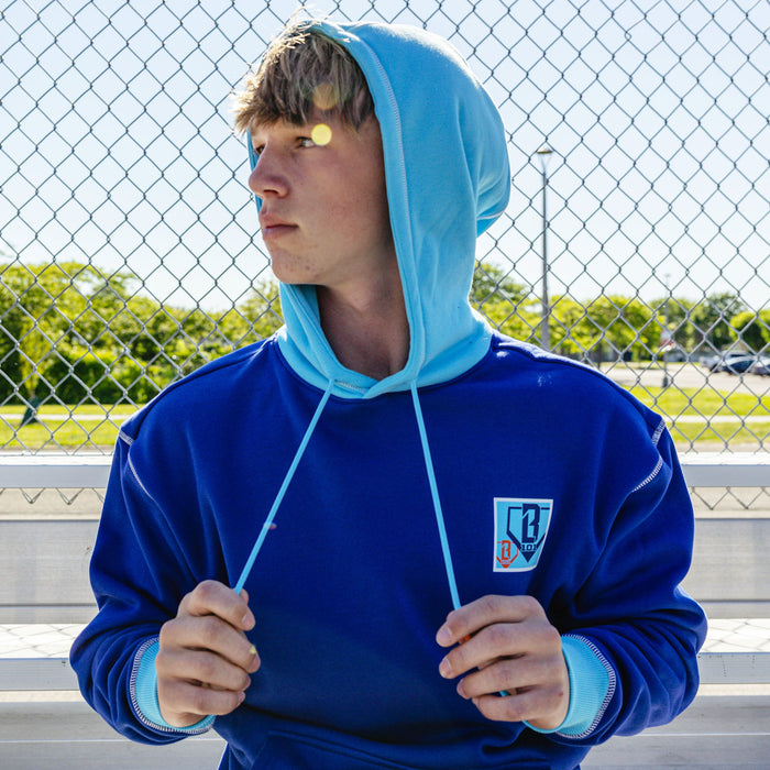 Adult model wearing navy hoodie with "Trash Talk" design