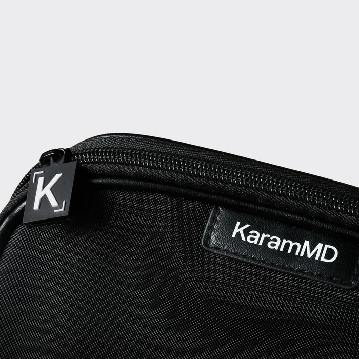 Black zippered case with KaramMD branding on a light gray background