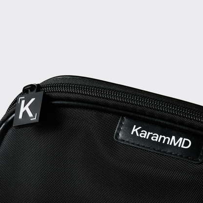 Black zippered case with KaramMD branding on a light gray background