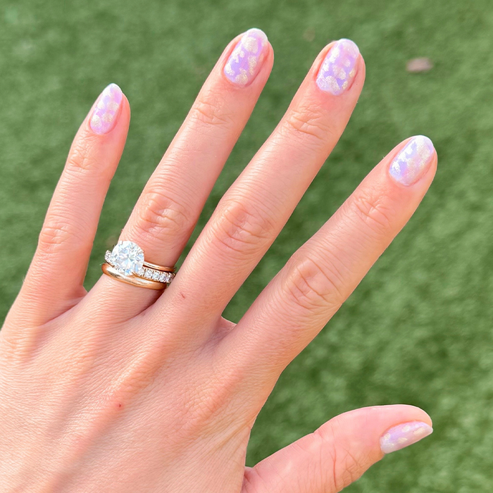 Watercolor Mermaid mani showing iridescent soft pink and purple polish with shimmering, magical underwater-inspired design