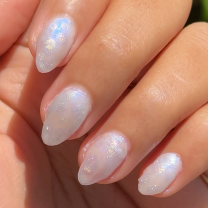 Watercolor Mermaid manicure with soft iridescent shimmer on almond-shaped nails in delicate pastel tones