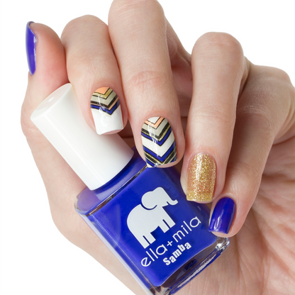 When the Sun Goes Down cobalt blue nail polish with gold glitter and chevron accent nail art
