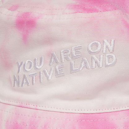 'YOU ARE ON NATIVE LAND' BUCKET HAT - PINK TIE DYE